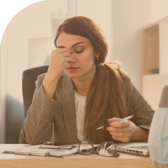 tired-businesswoman-working-desk-with-laptop